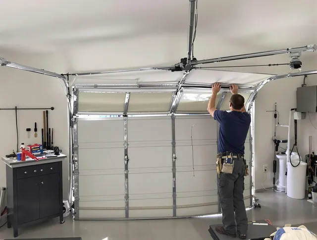 Charlotte Garage Door Repair specialist performing precise section replacement on Charlotte garage door