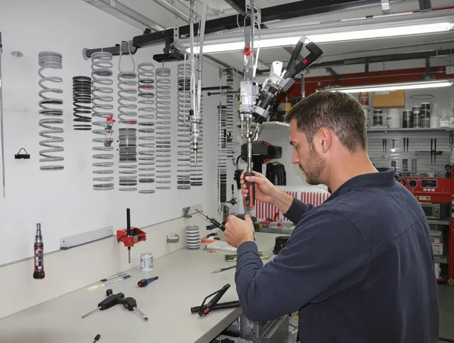 Charlotte Garage Door Repair safety certified technician performing precision spring replacement in Charlotte