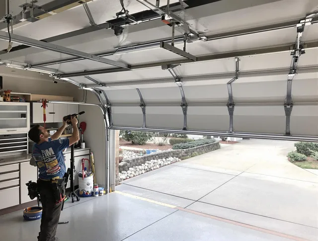 Garage door track repair service by Charlotte Garage Door Repair in Charlotte